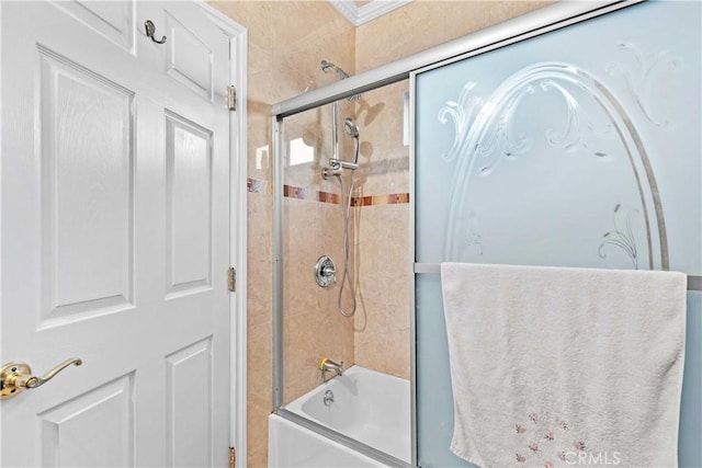 bathroom with bath / shower combo with glass door