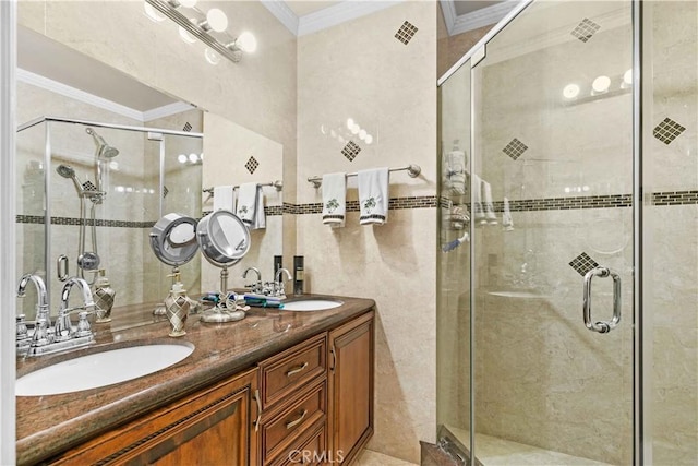 bathroom with ornamental molding, a shower with door, tile walls, and vanity