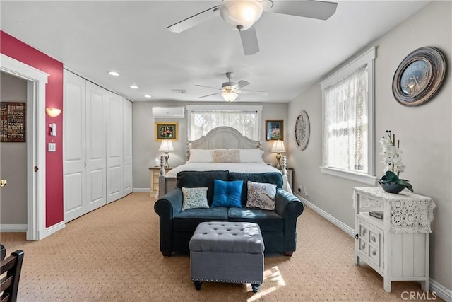 bedroom featuring recessed lighting, a ceiling fan, baseboards, a wall mounted AC, and a closet