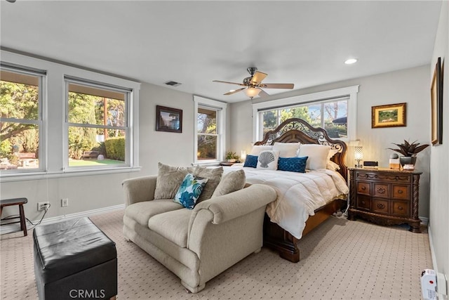 bedroom with ceiling fan, recessed lighting, light colored carpet, visible vents, and baseboards