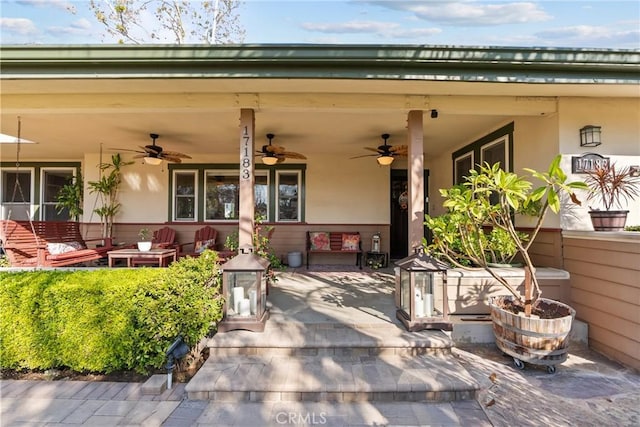 view of patio featuring ceiling fan