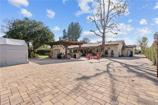 exterior space featuring a patio and a pergola