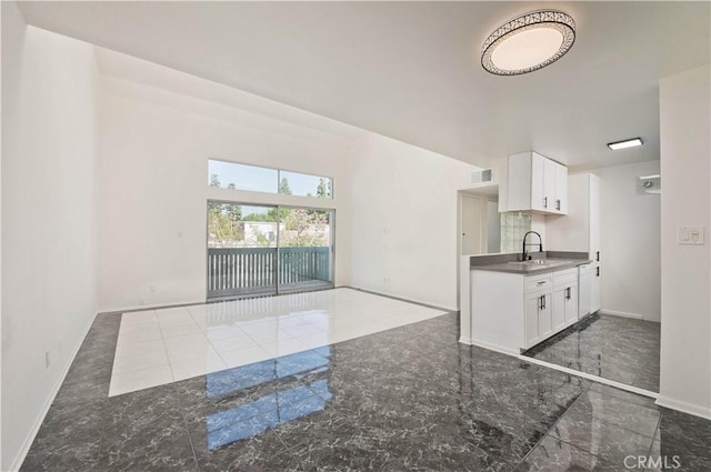 kitchen with sink and white cabinetry