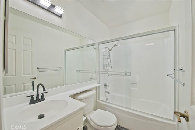 full bathroom featuring toilet, vanity, and shower / bath combination with glass door