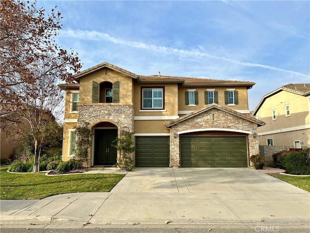 view of front facade featuring a front yard and a garage