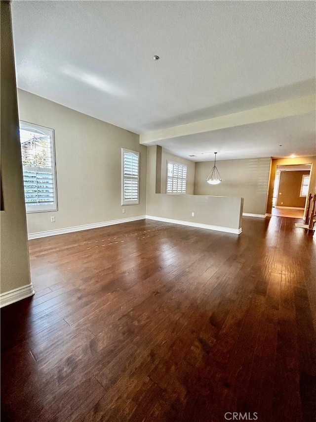 unfurnished room with dark hardwood / wood-style floors