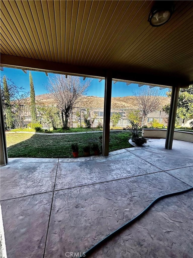 view of patio / terrace featuring a mountain view