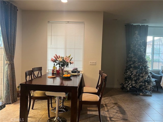 dining space with light tile patterned floors