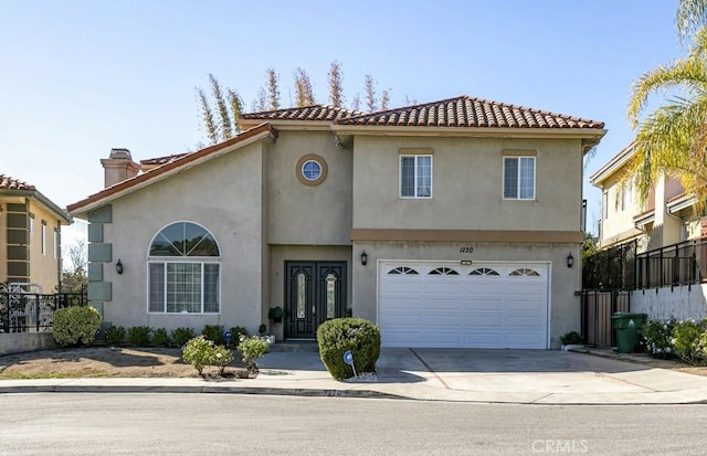 mediterranean / spanish-style house featuring a garage