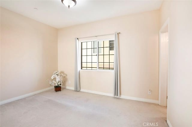 empty room featuring light colored carpet