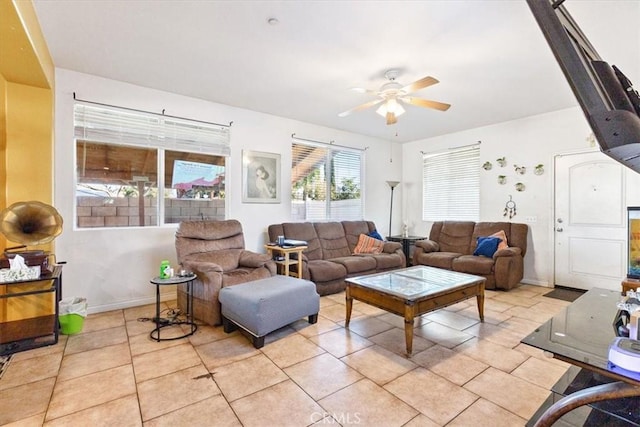 living room featuring ceiling fan and light tile patterned floors