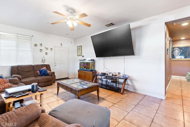 tiled living room featuring ceiling fan