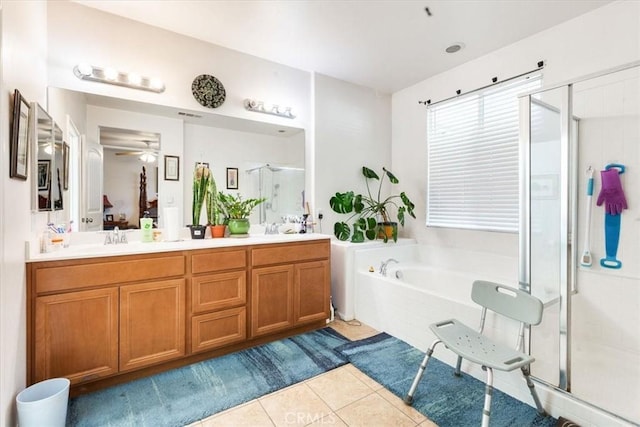 bathroom with independent shower and bath, vanity, and tile patterned floors