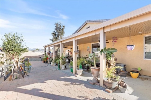 view of patio with ceiling fan