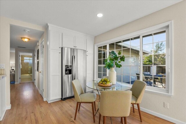 dining area with light hardwood / wood-style floors