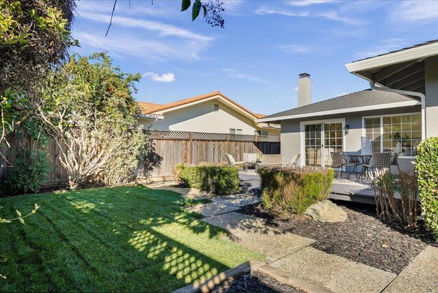 view of yard featuring a wooden deck