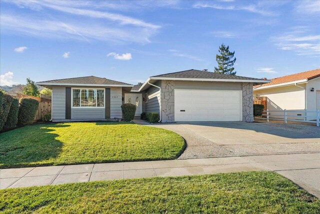 single story home with a front lawn and a garage