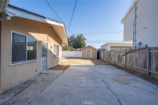 view of patio with a shed