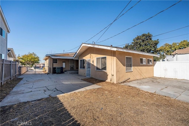 rear view of property with a patio area