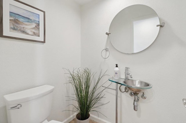 bathroom with toilet and sink