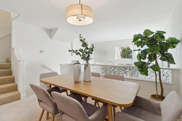 view of carpeted dining space