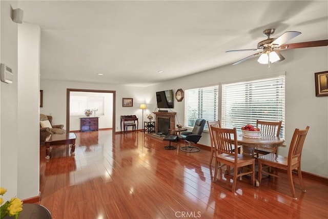 dining area featuring hardwood / wood-style flooring, ceiling fan, and a healthy amount of sunlight