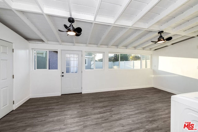 unfurnished sunroom featuring washer / clothes dryer, ceiling fan, and vaulted ceiling with beams