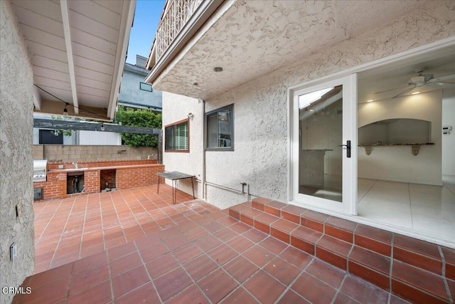 view of patio featuring area for grilling and exterior kitchen