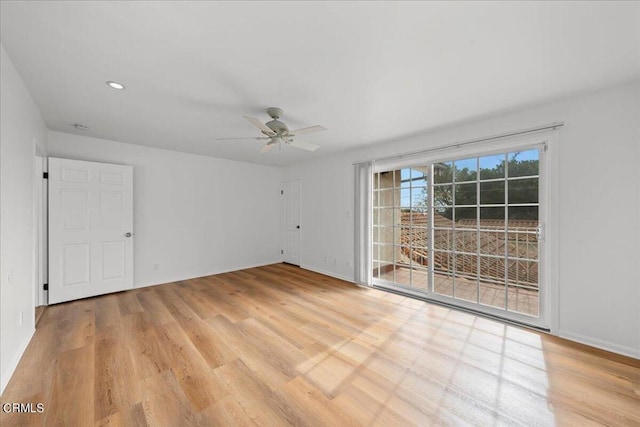 unfurnished room with ceiling fan and light hardwood / wood-style flooring