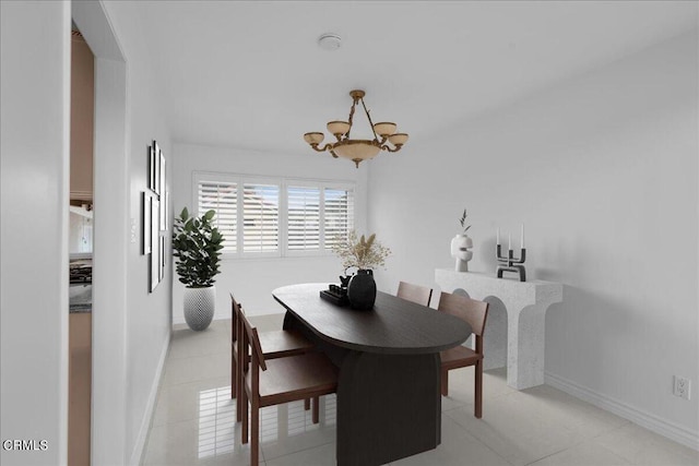 dining space featuring a chandelier and light tile patterned floors