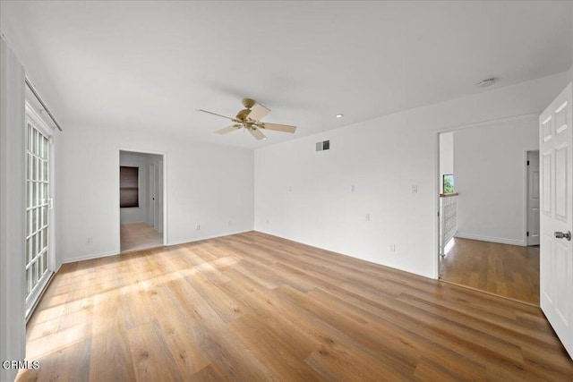 unfurnished room featuring ceiling fan and light hardwood / wood-style flooring