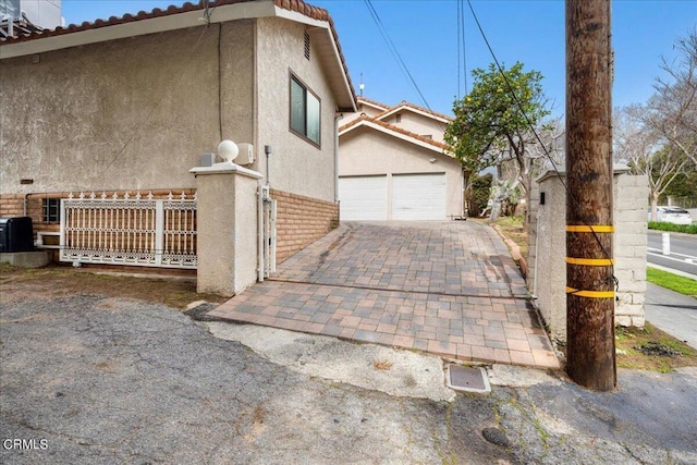 view of property exterior featuring a garage