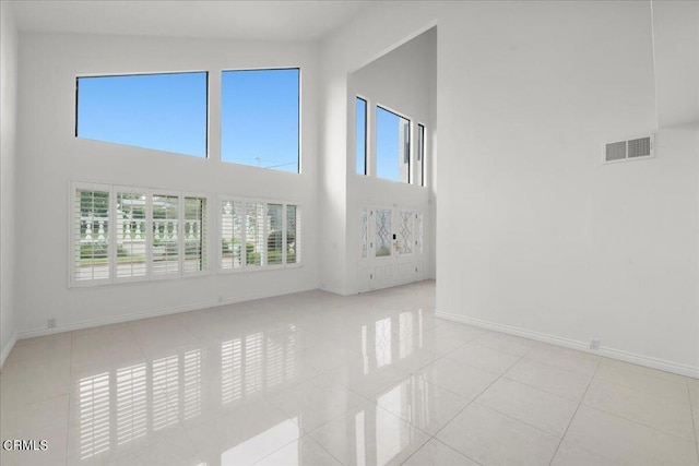 unfurnished living room with light tile patterned floors