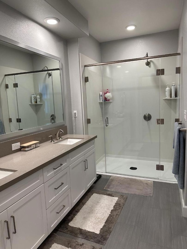 bathroom with vanity and walk in shower