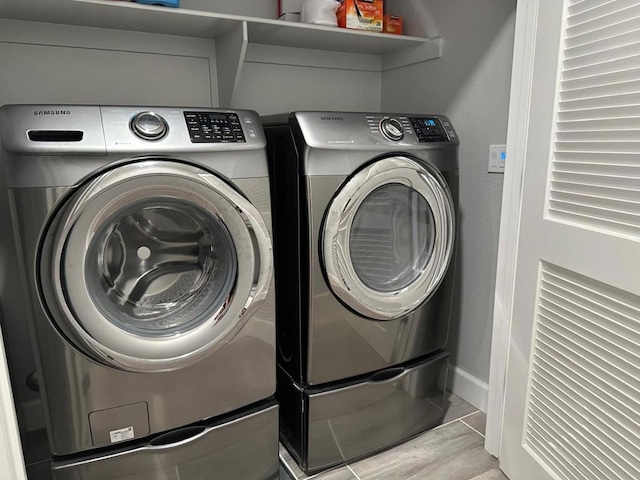 laundry room featuring separate washer and dryer