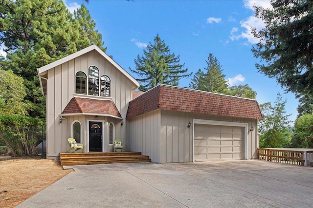 view of front facade with a garage and an outdoor structure