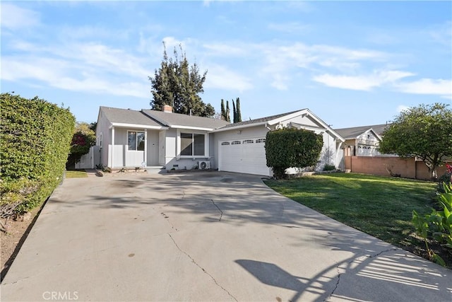 single story home with a front yard and a garage