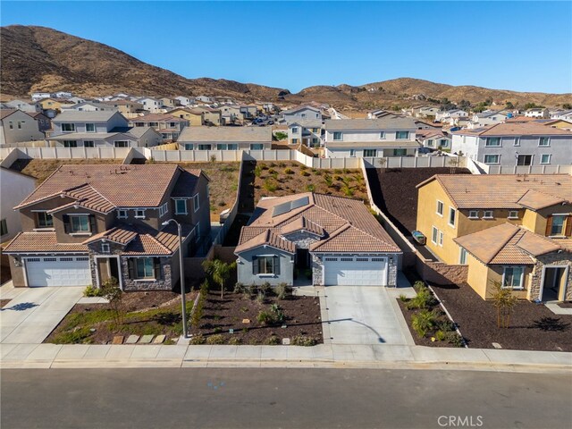 view of front of house featuring a garage and a mountain view