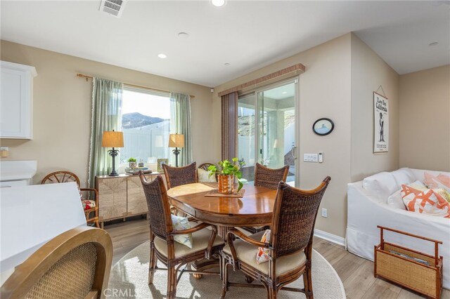 dining room with light hardwood / wood-style floors