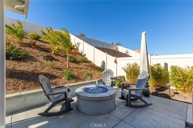 view of patio / terrace with a fire pit