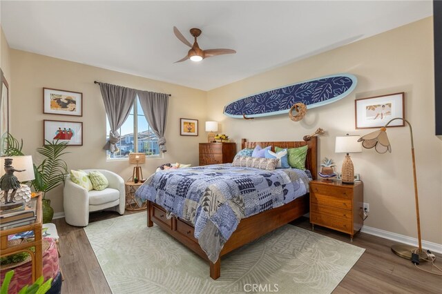 bedroom featuring ceiling fan and hardwood / wood-style floors