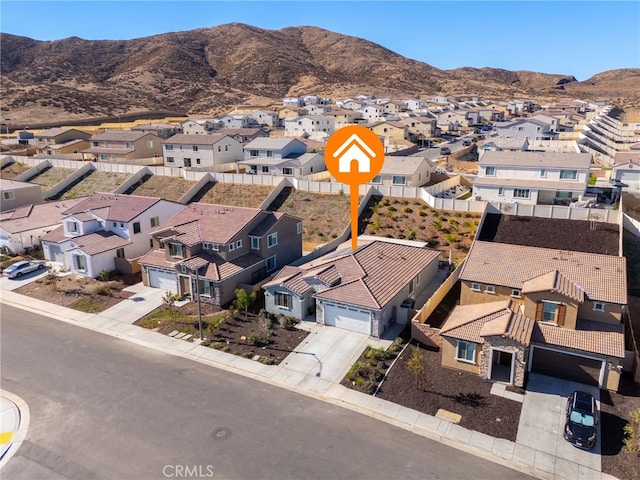 birds eye view of property featuring a mountain view