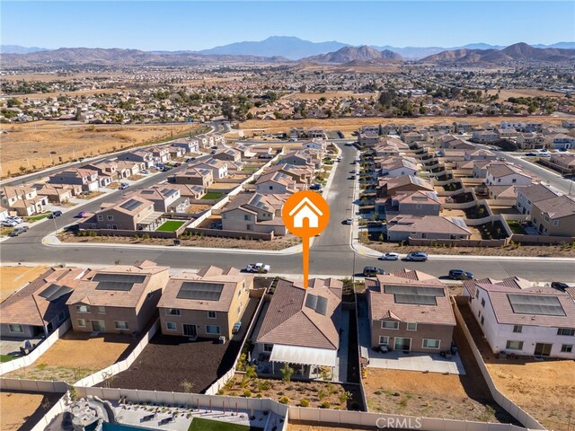 birds eye view of property with a mountain view