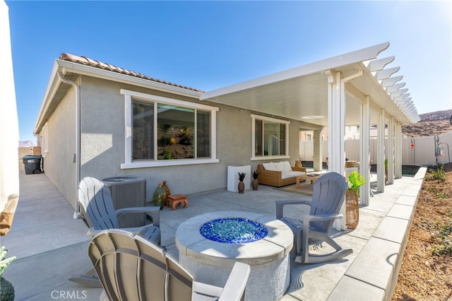 back of property featuring an outdoor living space with a fire pit, a patio, a pergola, and central air condition unit