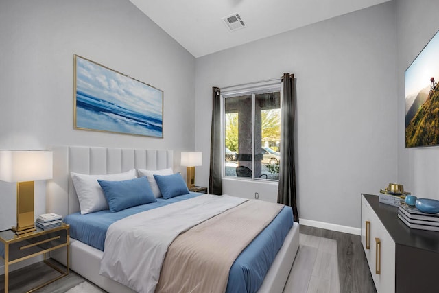 bedroom with wood-type flooring