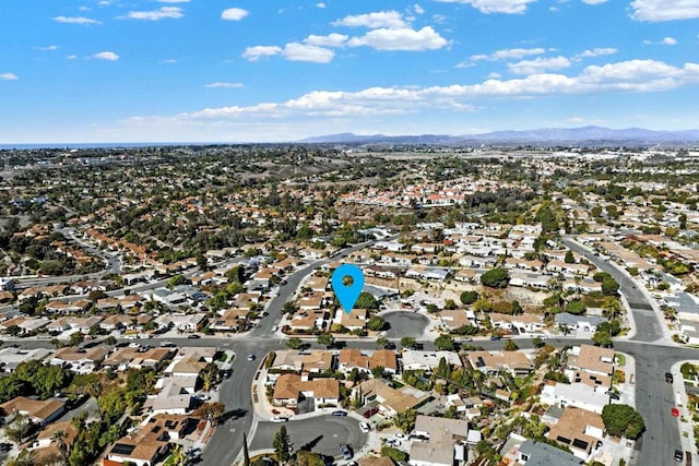 birds eye view of property with a mountain view