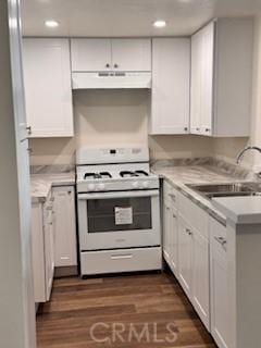 kitchen featuring white cabinets, dark hardwood / wood-style floors, sink, and white range with gas cooktop