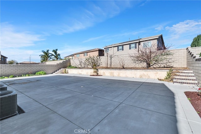 exterior space with a patio area and central AC unit