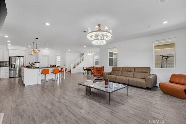 living room featuring a chandelier