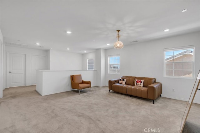 living room featuring a wealth of natural light and light carpet